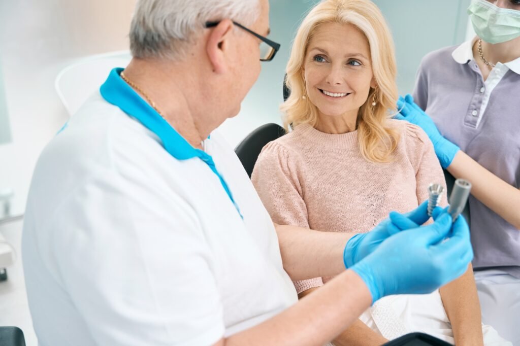 Woman selecting prosthesis or pin for treatment